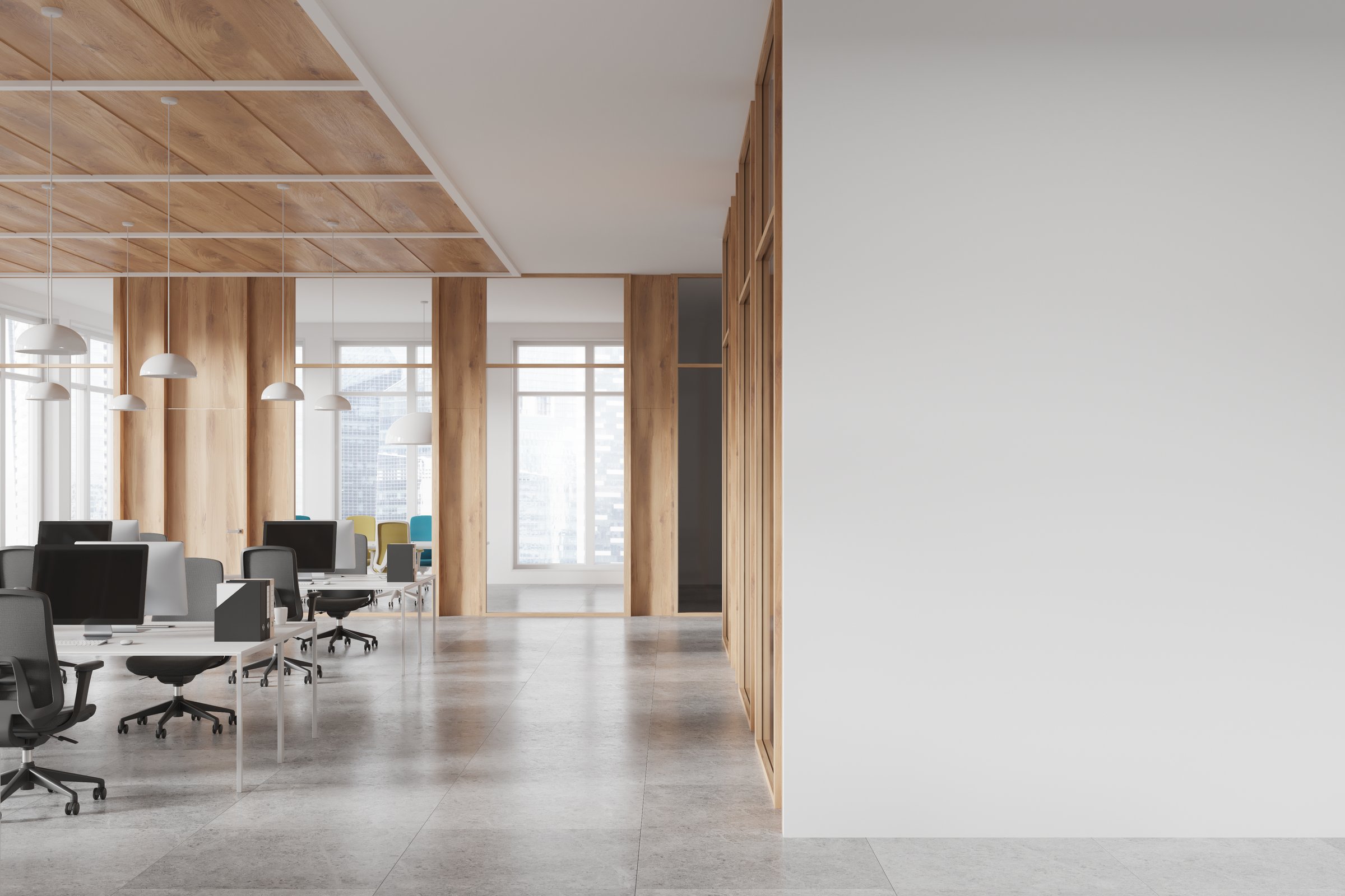 Stylish coworking interior with pc computers on desks in row, tile concrete floor. Workspace with glass meeting room, panoramic window on Singapore. Mock up empty wall partition. 3D rendering