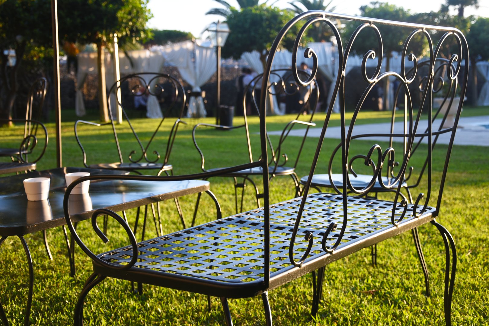 Metal patio furniture in decorated yard