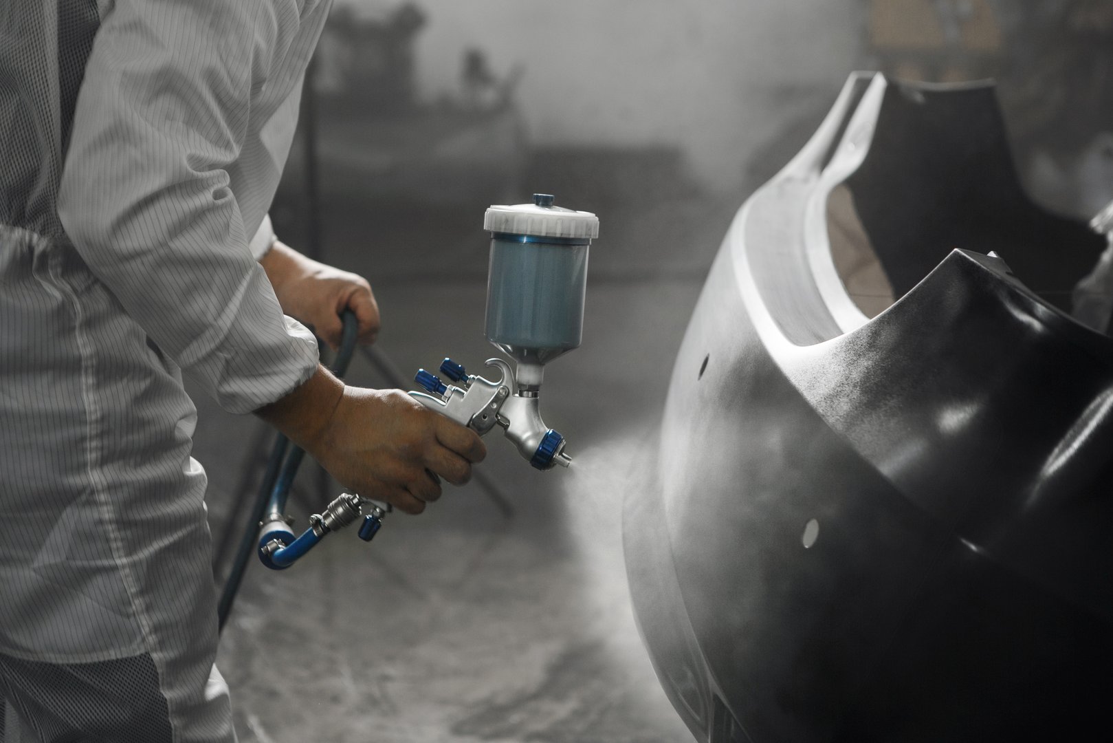 Application of primer before the main spray painting part of car. Repair and restoration of vehicle after the accident.