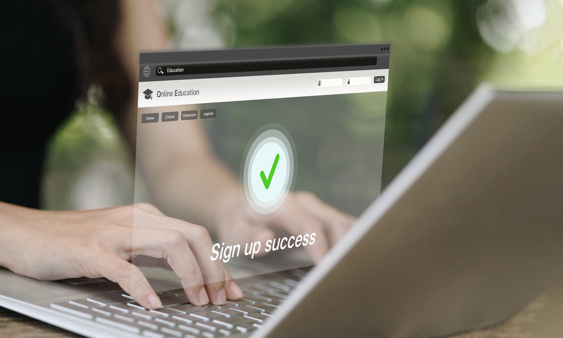 Hands typing on laptop showing online education platform with sign up success screen. Concept of digital learning, e-learning, registration, and modern education technology.