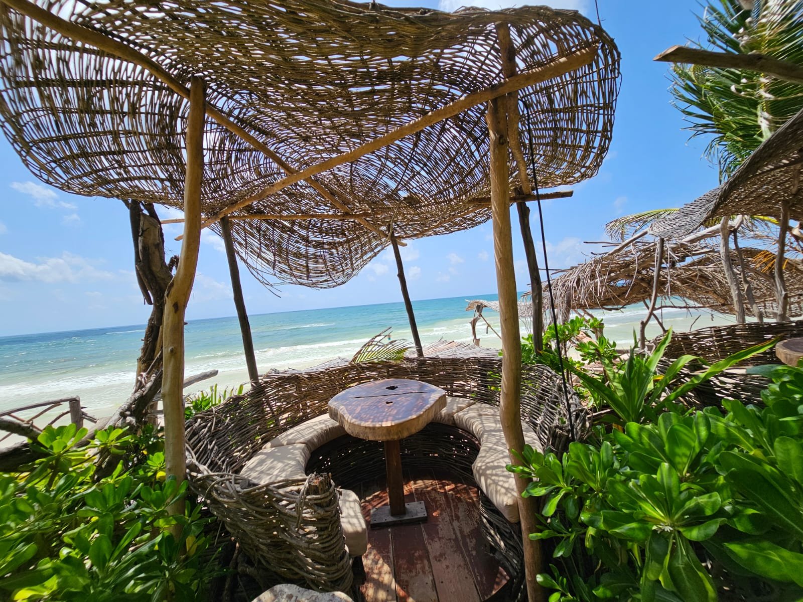 Stunning beachfront view of Tulum Hotel Zone with luxury eco-resorts and pristine Caribbean coastline