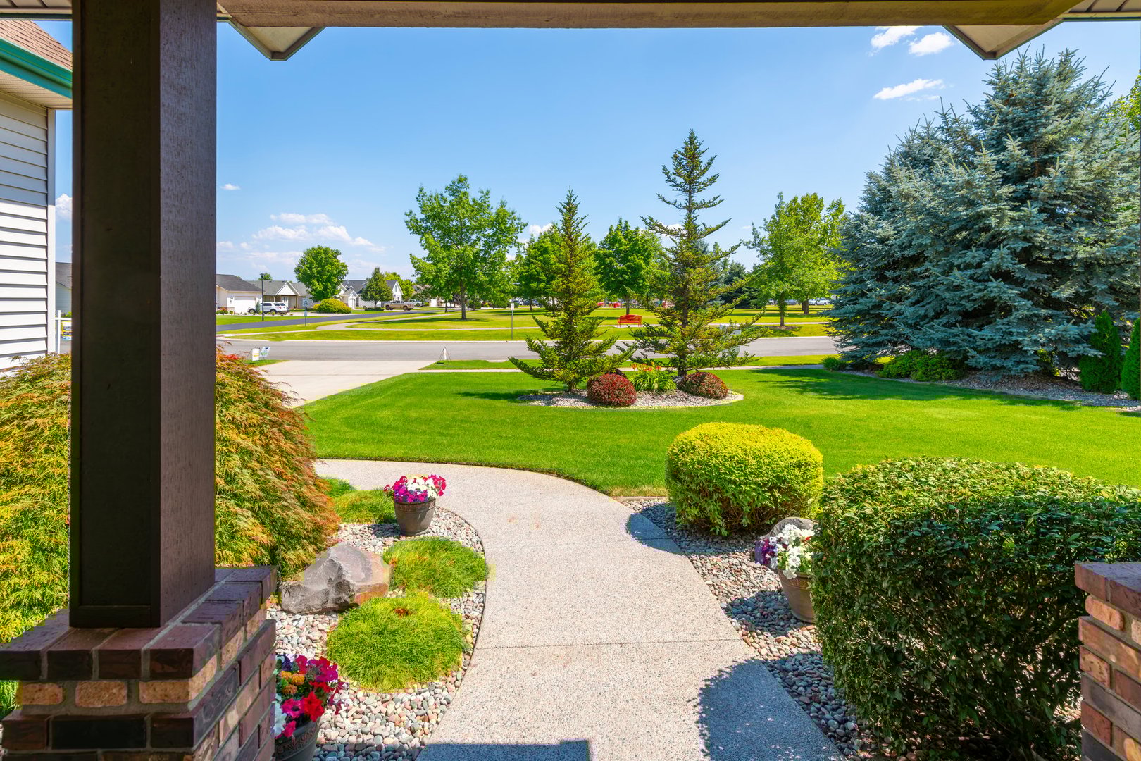 A small rural park seen from a street of homes in a suburban community in Coeur d'Alene, Idaho USA, in the North Idaho panhandle.