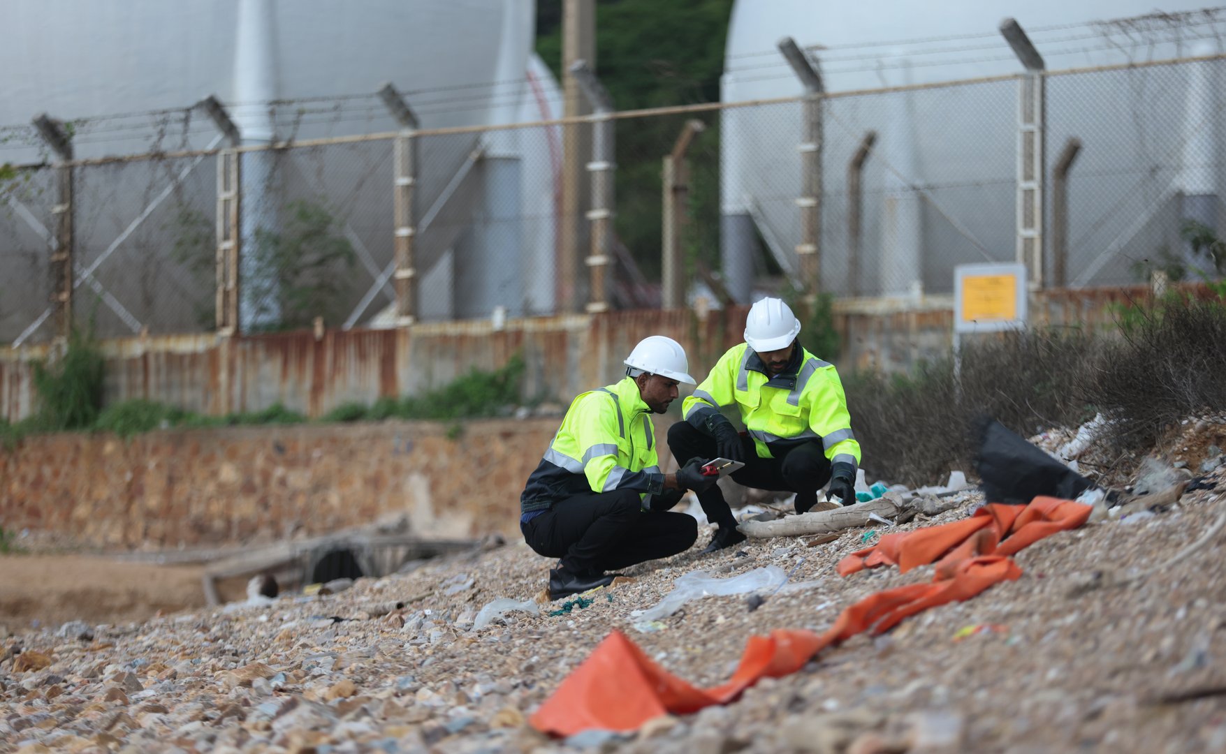 Environment engineer team with green safety jacket and PPE audit environment around factory Industrial and environment