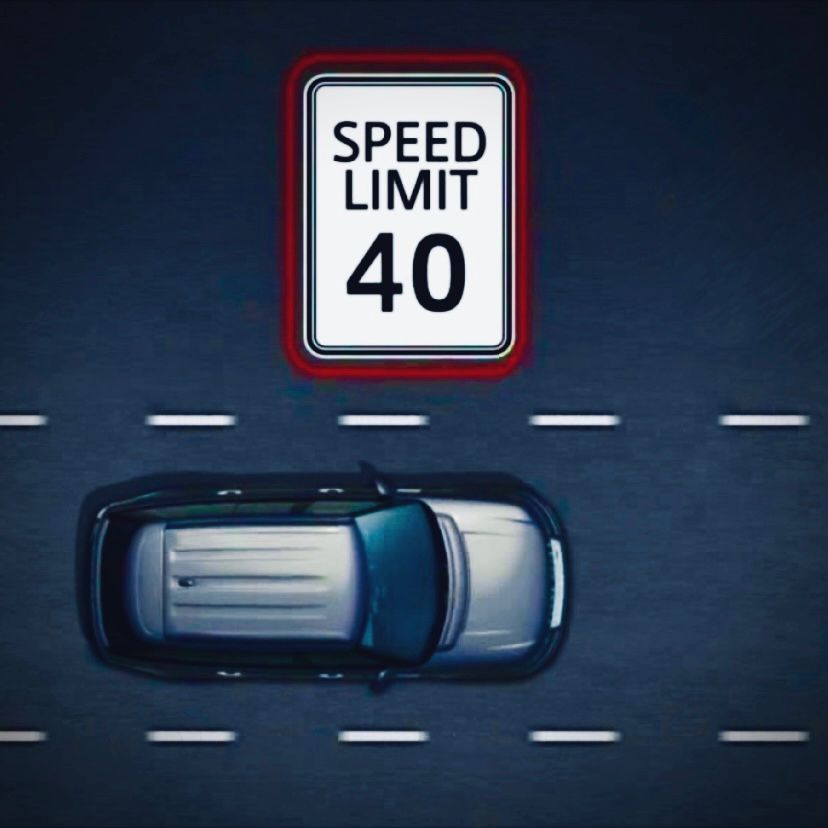 Traffic sign recognition system displaying speed limits and road signs on dashboard