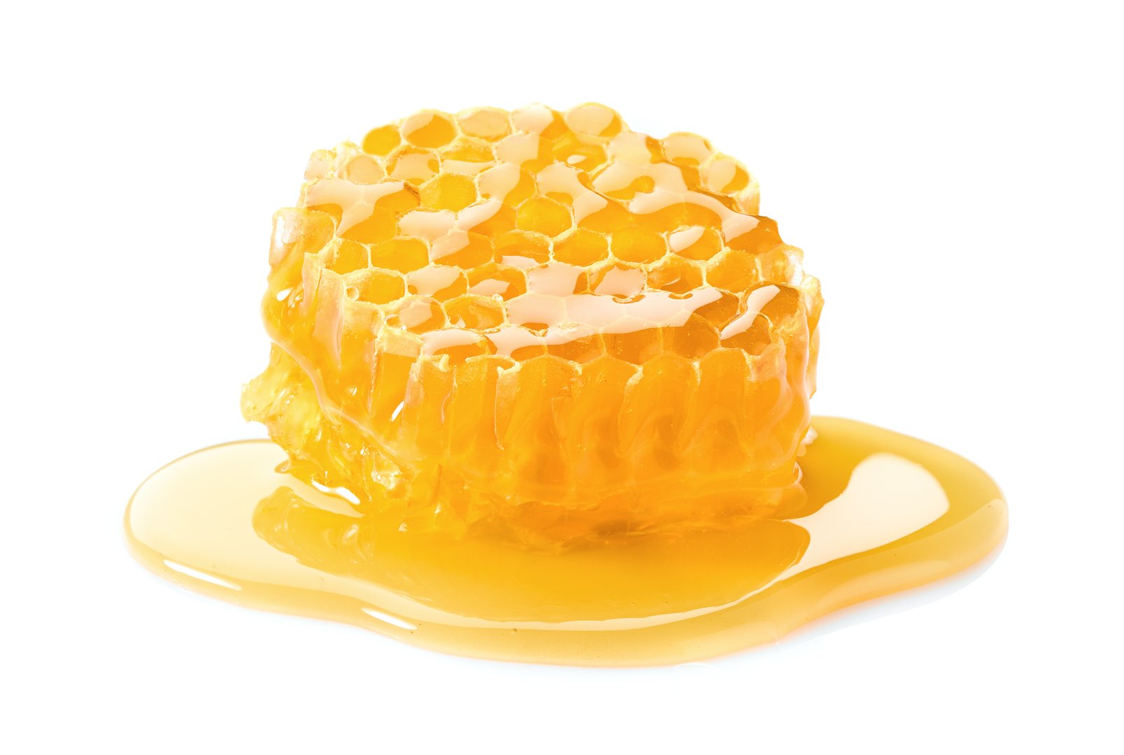 Honeycomb with honey on white background