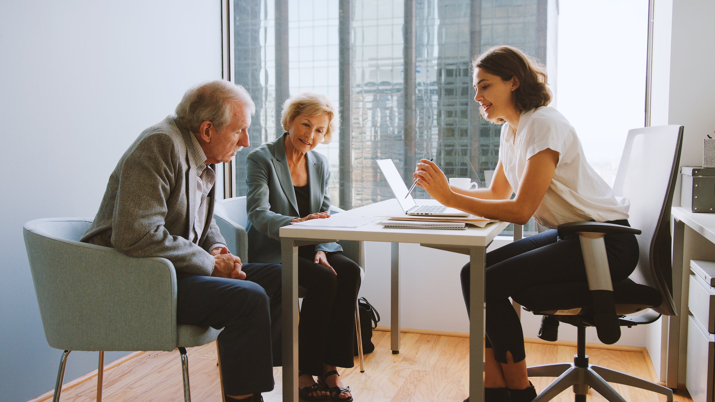 Senior Couple Meeting With Female Financial Advisor