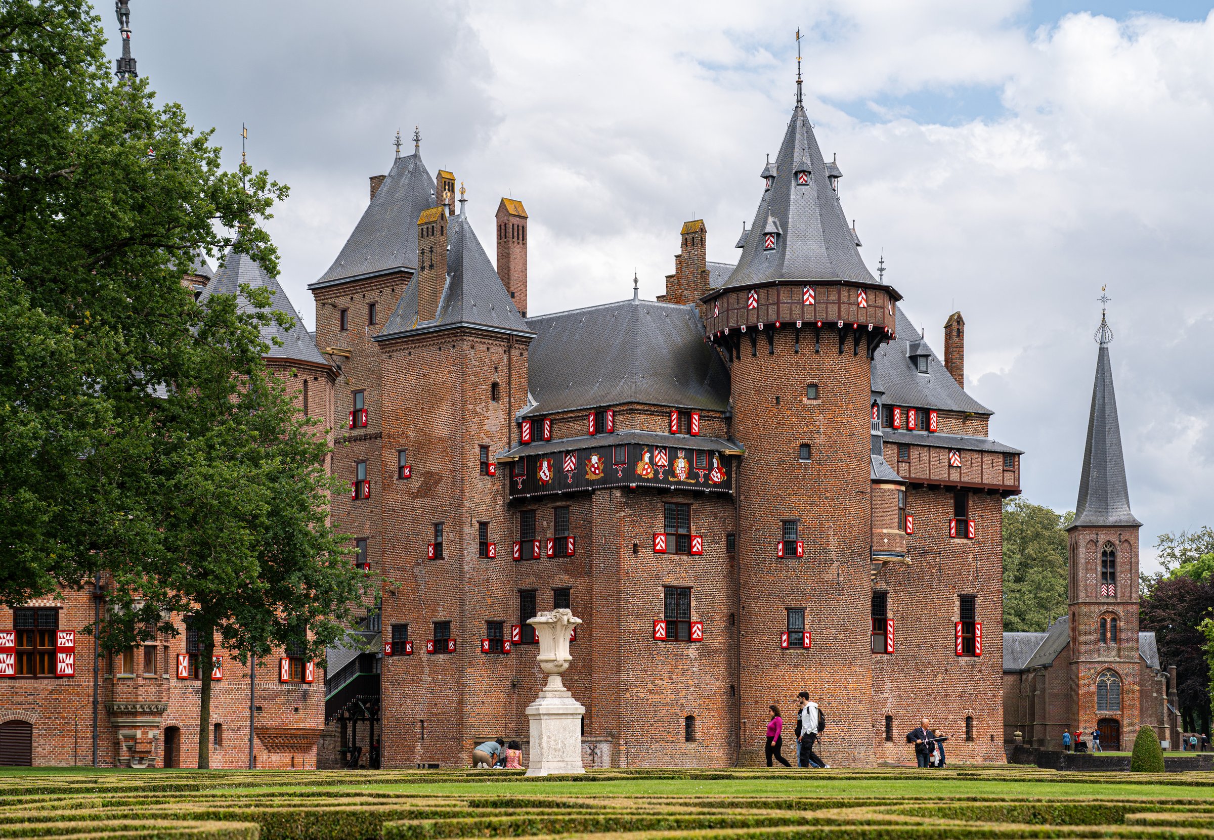 Utrecht, Netherlands - June 8, 2024: Museum Castle De Haar with Visitors in the Garden, One of the Most Popular Dutch Castles