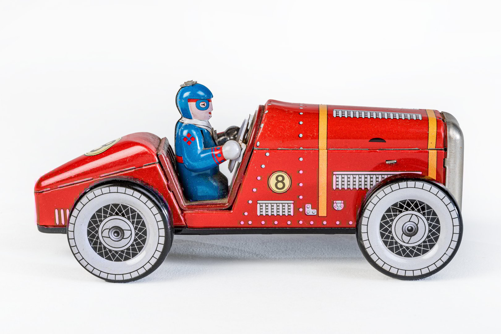 Metallic vehicle with its pilot on the steering wheel