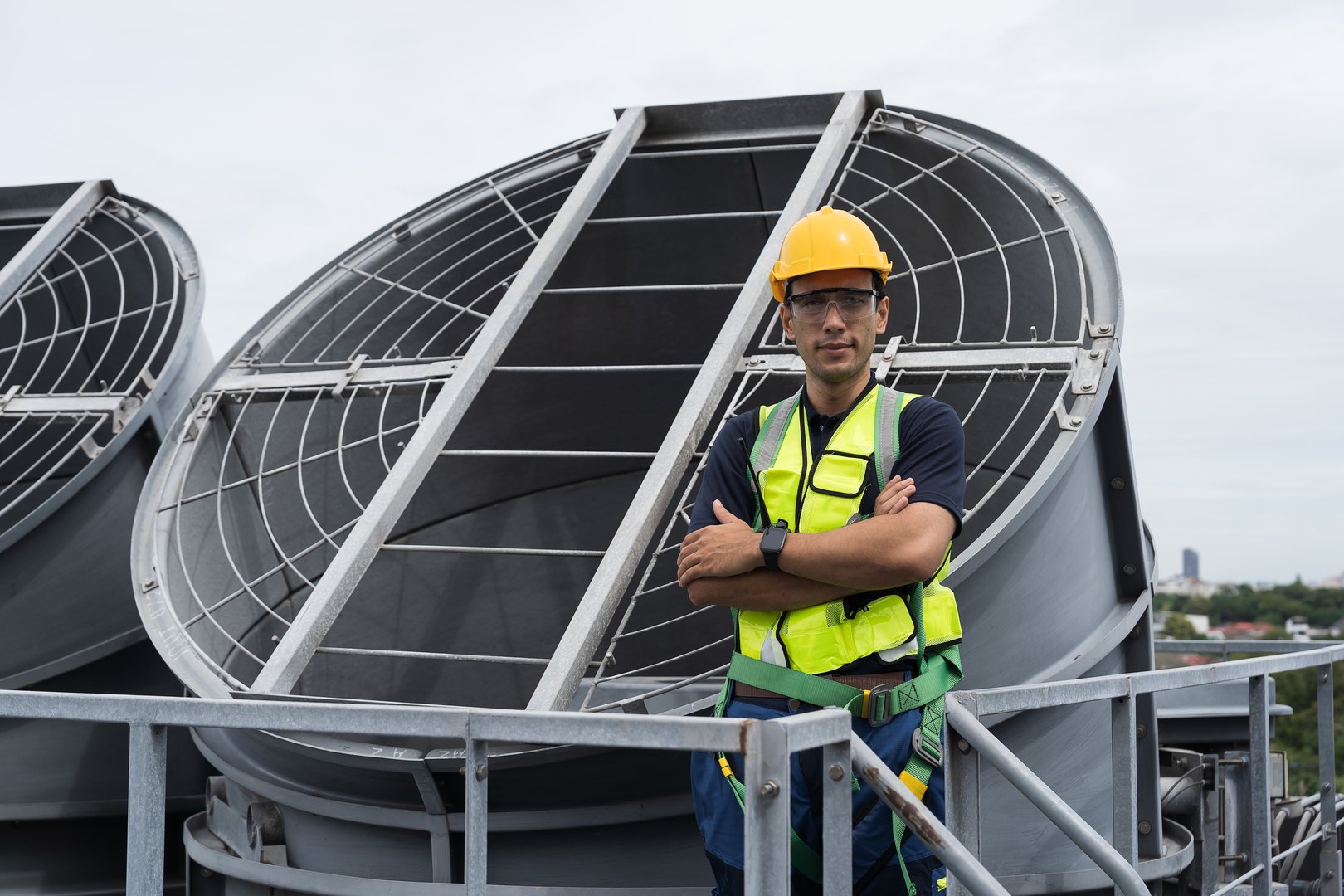 Cooling tower operations, Legionnaires disease prevention. Engineer or technicians maintenance and repair of cooling towers for preventing issues Legionella growth on rooftop of building