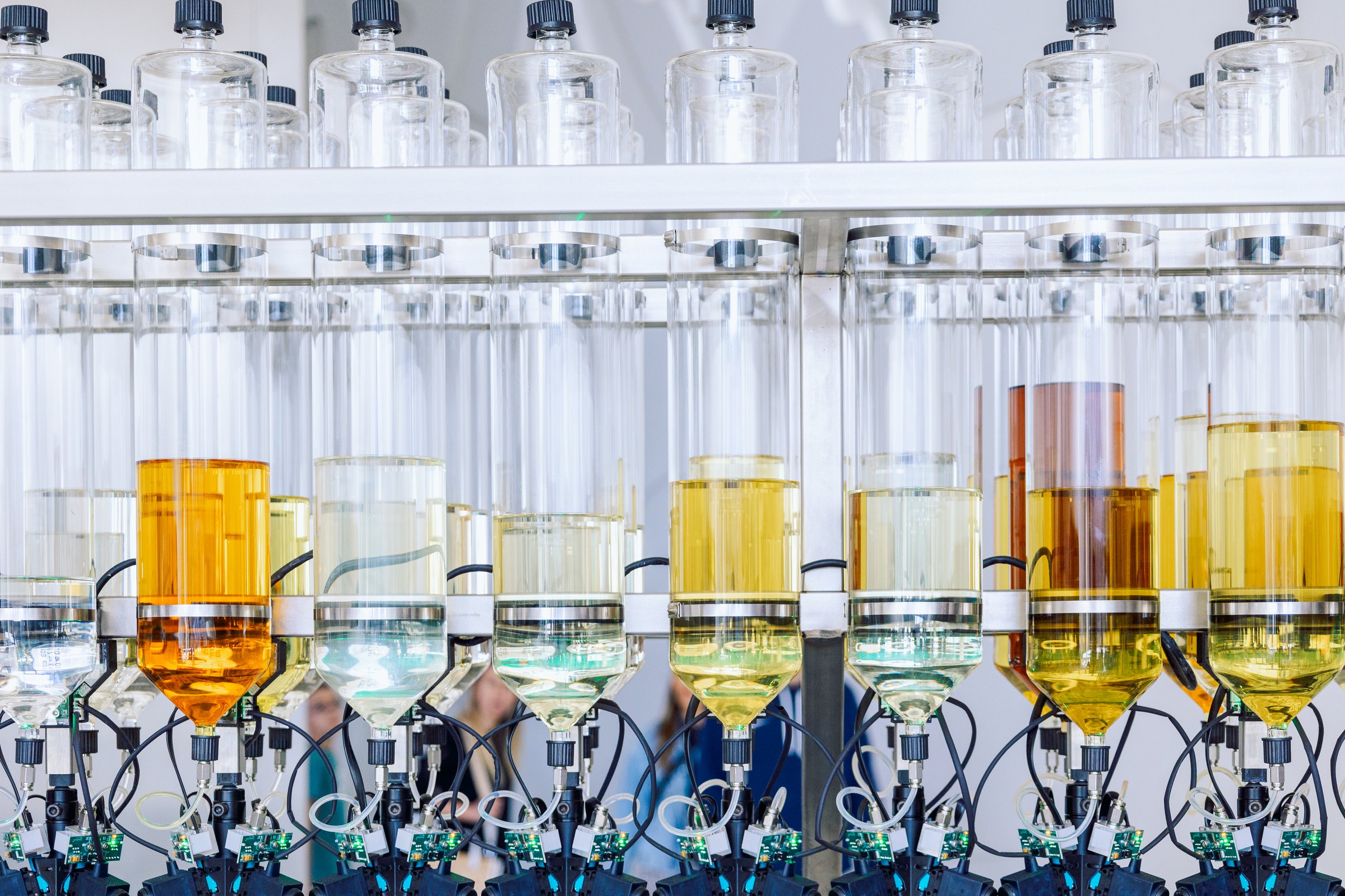 Glass bottles flasks with aroma oils for making perfumes in row