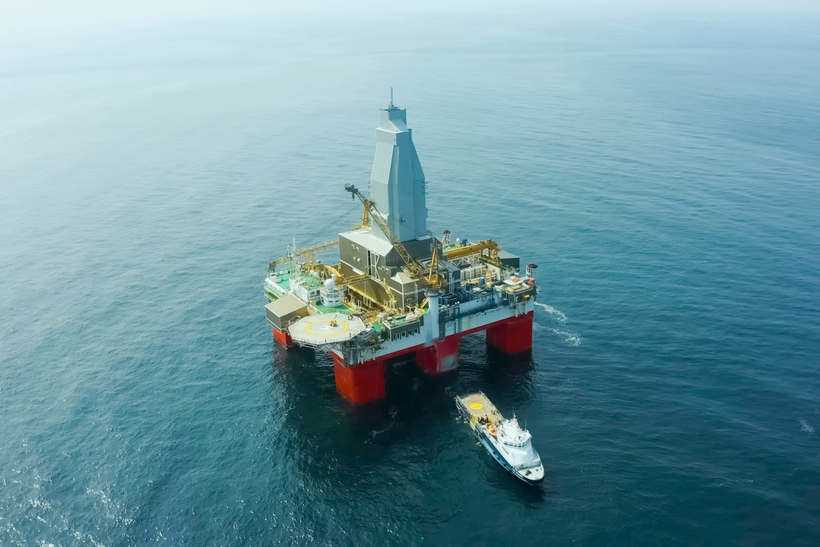 Oil Offshore Platform At Sea And Near It Service Ships For Service And Rescue Service