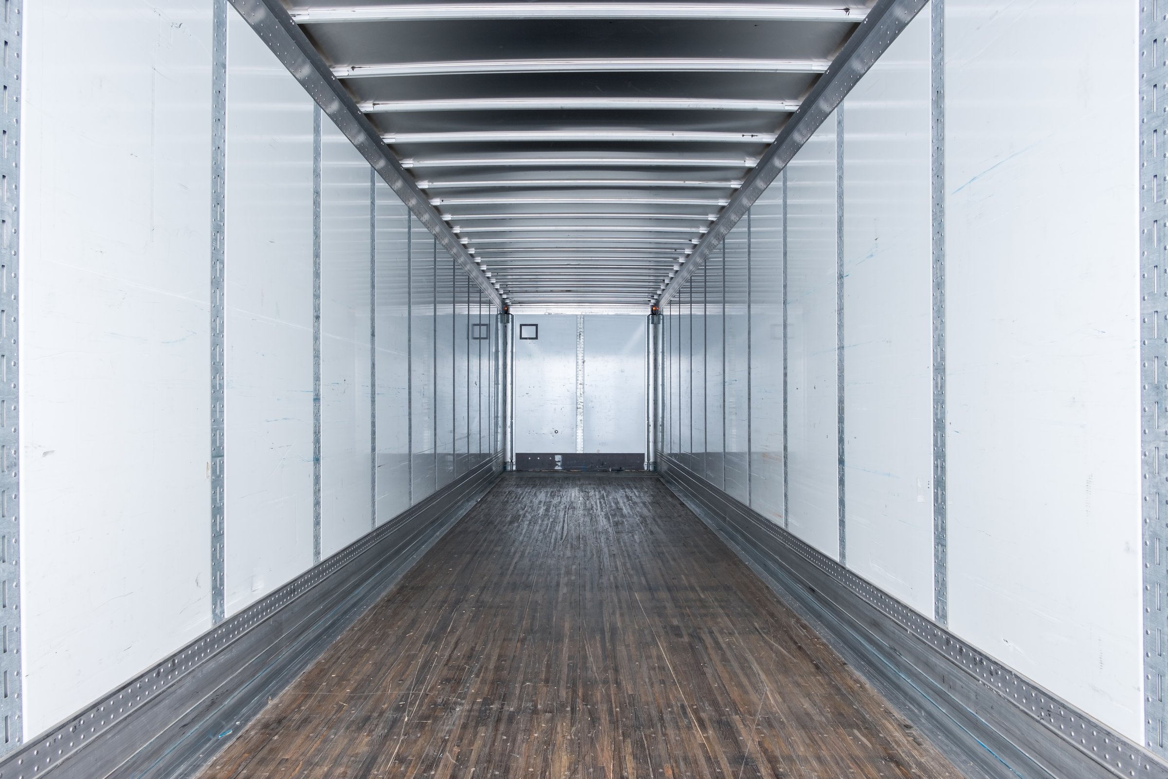 Interior view of empty semi truck dry van commercial trailer