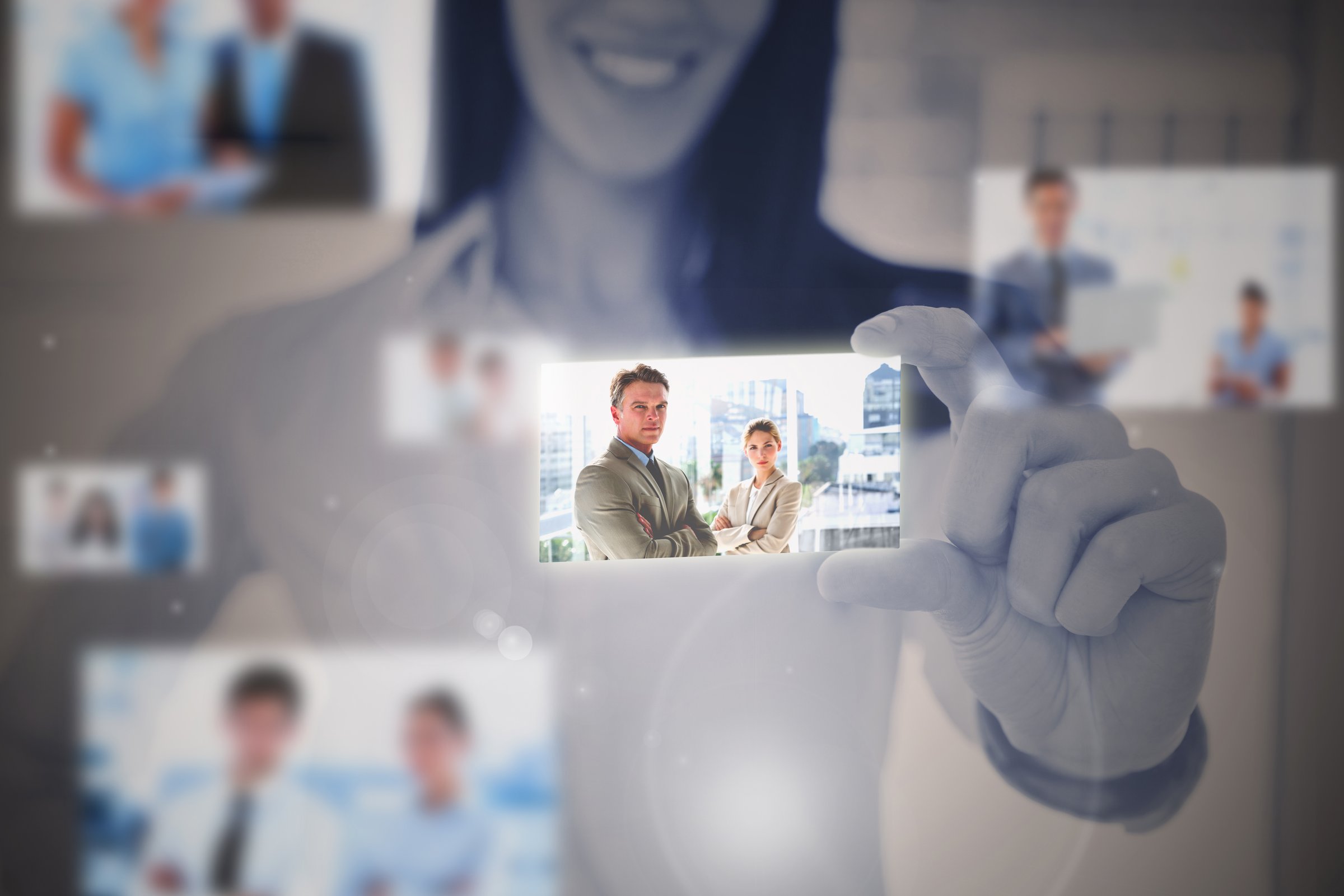 Businesswoman using digital interface showing business people