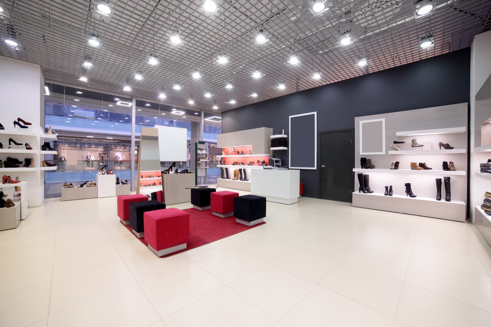 bright and fashionable interior of shoe store in modern mall