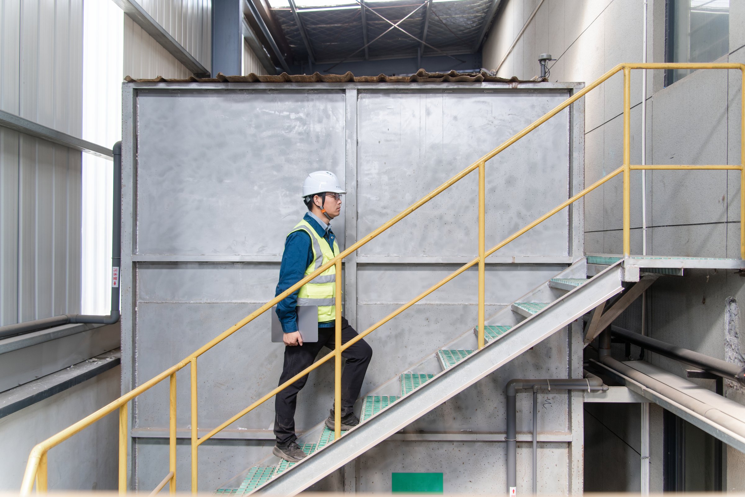 Factory engineer with laptop