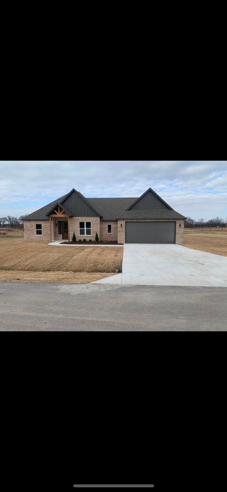 Modern spiral staircase view from above. The staircase is constructed with smooth, light-colored wood, creating a sleek and elegant appearance. The steps are made of concrete, adding a contrasting texture to the wooden surface. The design is minimalist, with clean lines and a curved structure that adds a sense of movement and flow. The staircase is well-lit, with subtle lighting highlighting the texture of the wood and the steps.