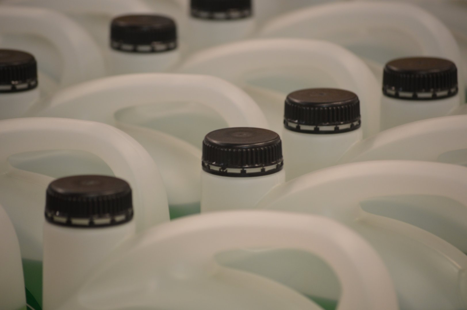 Packaging containers for household chemicals on store shelves