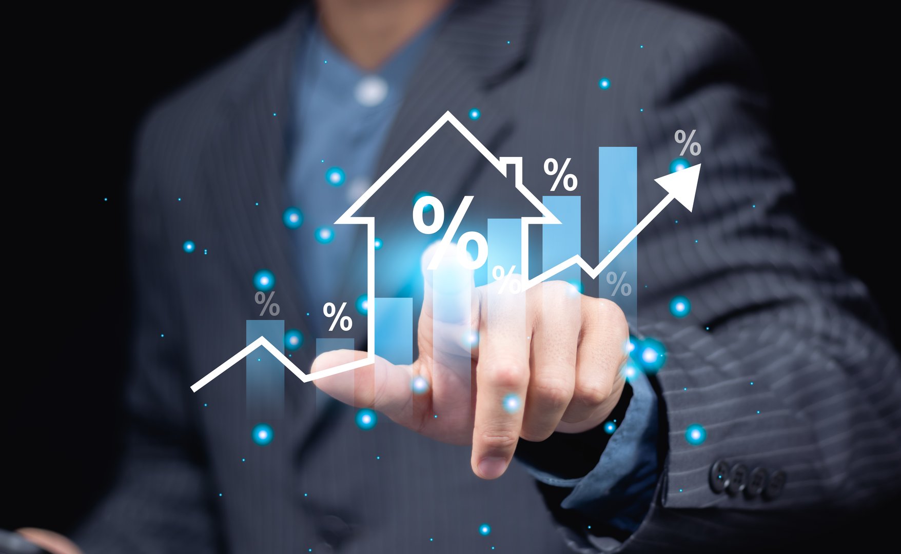 Businessman hands and virtual graph showing real estate market growth. Perfect for financial, real estate and investment presentations. Real estate market analysis concept.