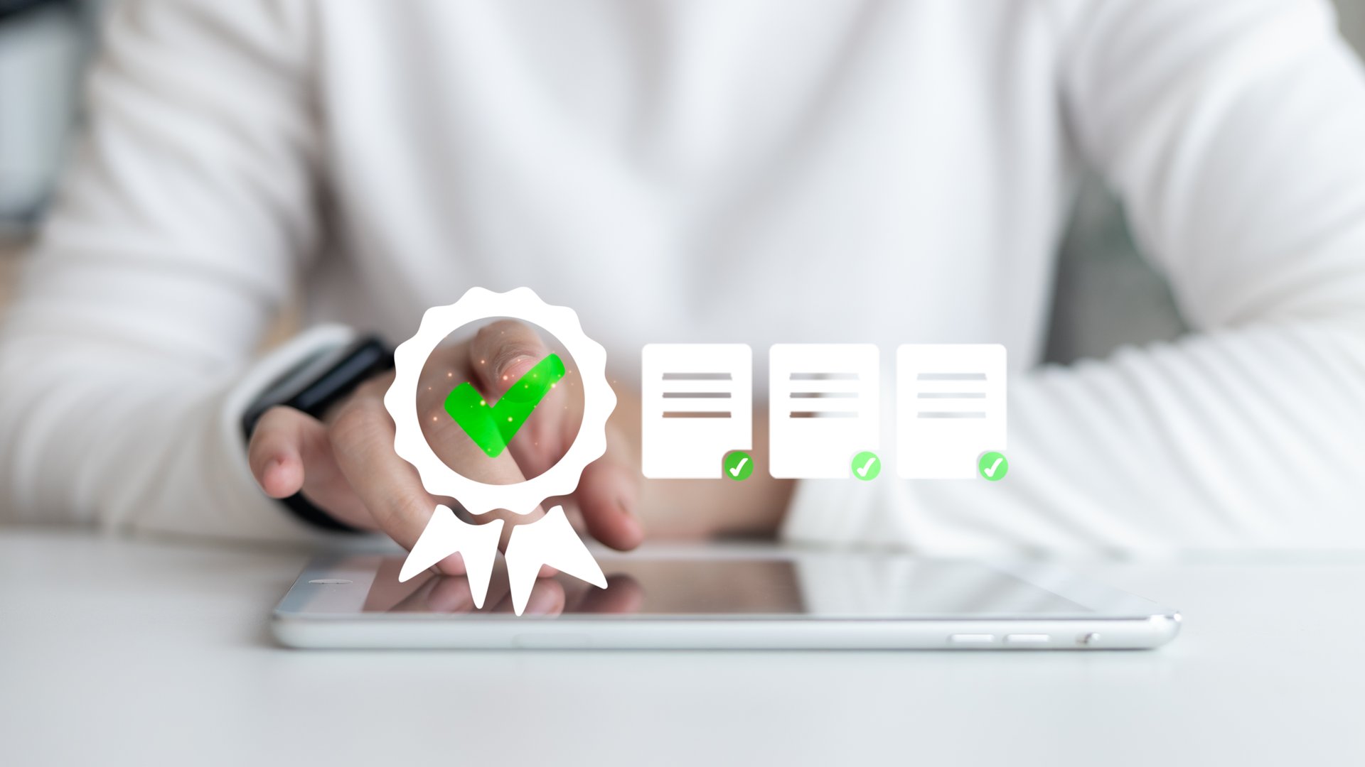 Hand tapping on digital badge icon with green check mark on tablet screen, document certification, quality control, digital approval process in a business environment.
