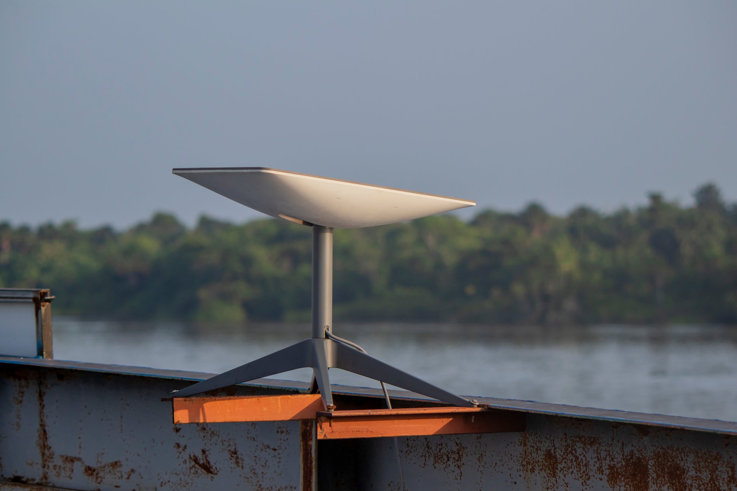 Breves, Para, Brasil - Sep 09, 2024: Starlink satellite internet dish providing broadband connection on the top of a passenger boat navigating in the Amazon region