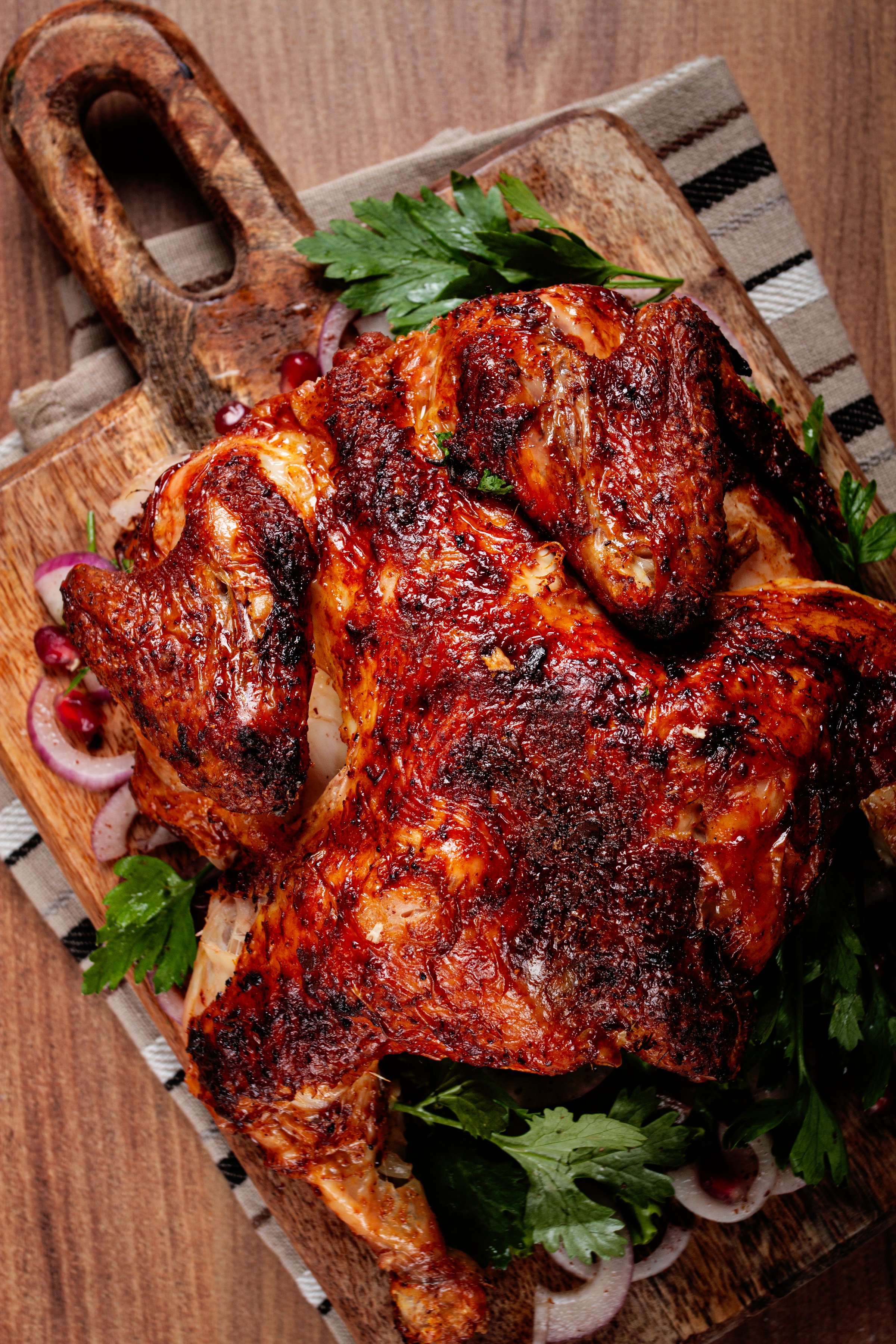 whole fried chicken, with spices, grilled chicken, on a chopping board, top view, homemade, no people,