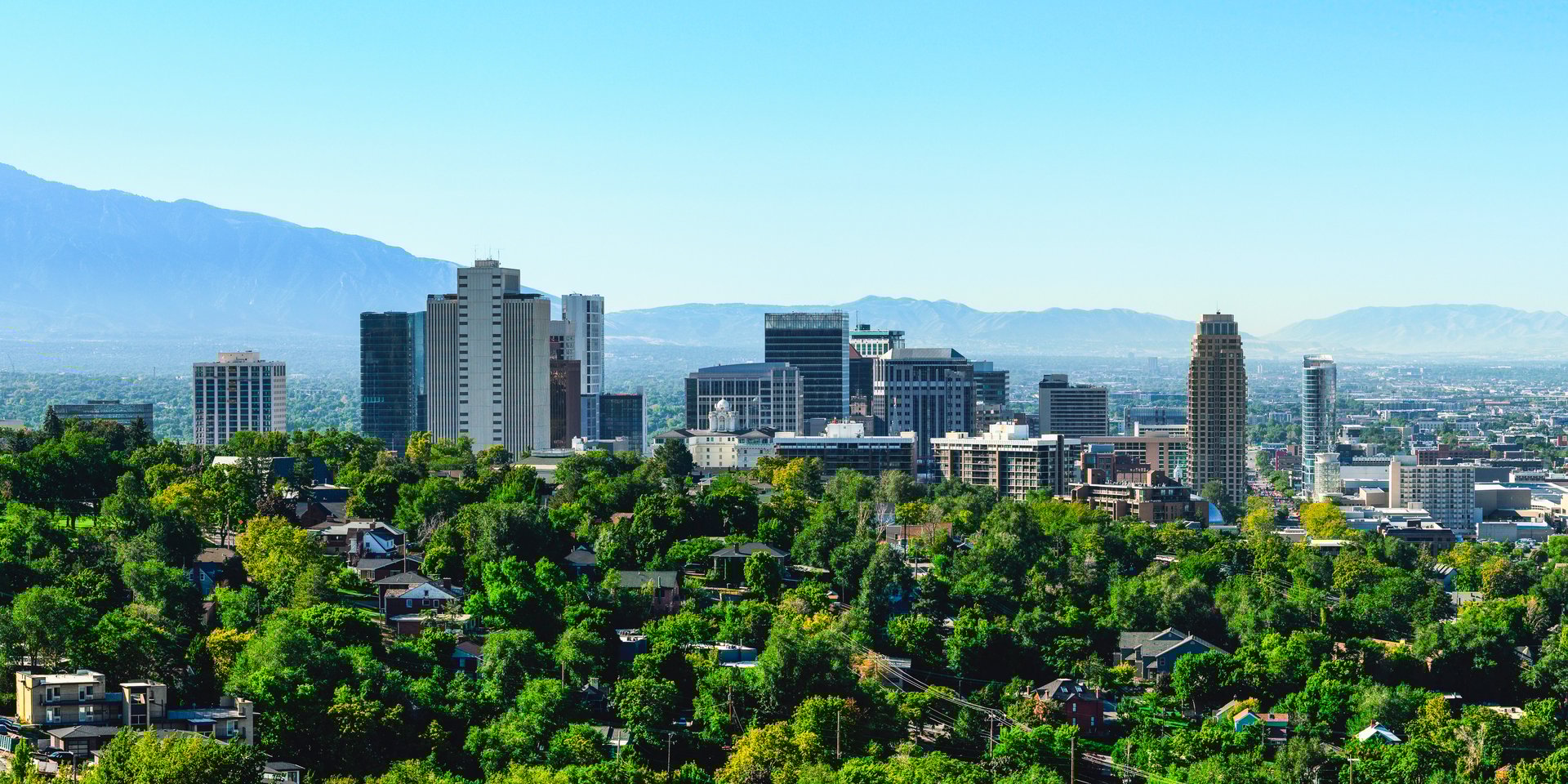 Salt Lake City Sunrise Skyline, Skyscrapers, and Buildings in Utah, USA: A tranquil metropolitan modern cityscape of The Crossroads of the West on a summer morning
