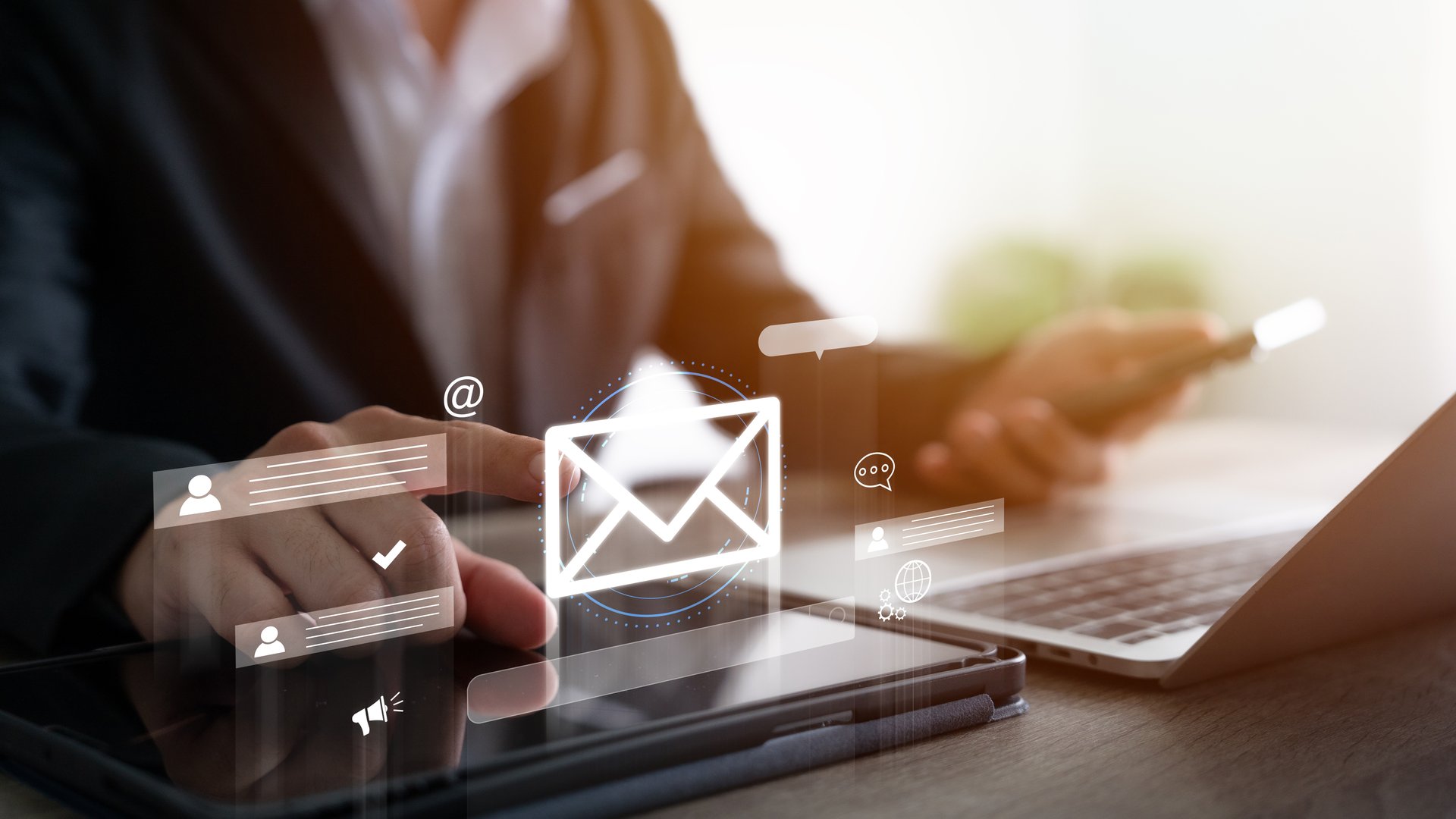 Digital marketers use email marketing tools on their laptops and smartphones to send out newsletters.