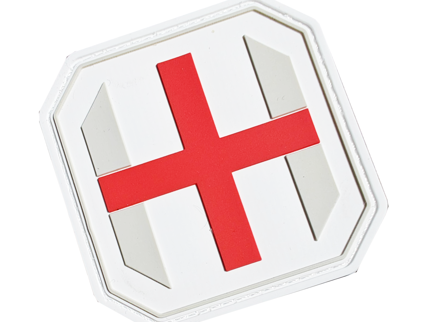 White shield with a bold red cross in the center, featuring two gray diagonal stripes.