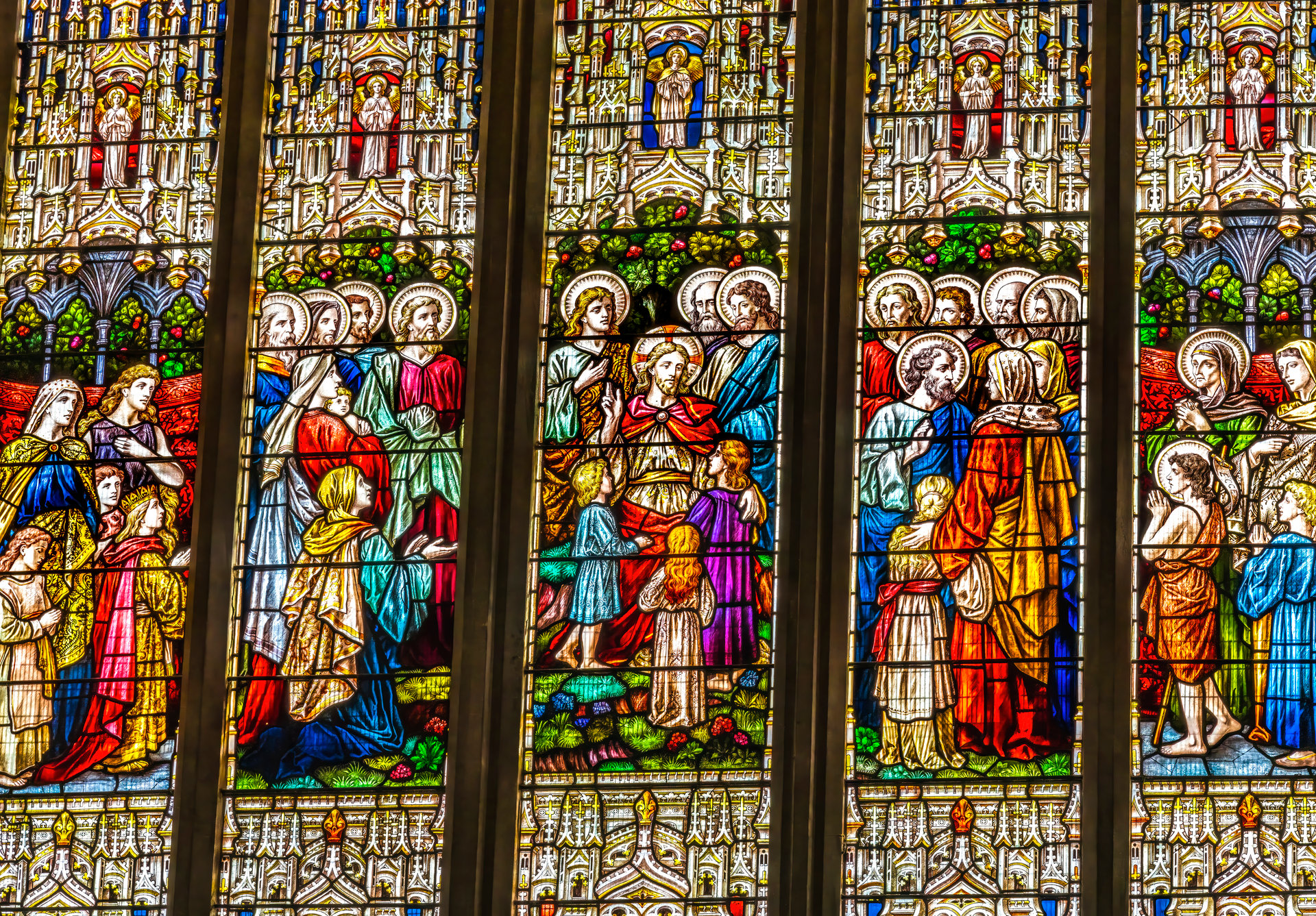 Colorful Jesus Children Disciples Stained Glass St Saviour's Church Basilica Dartmouth Devon England.  Church originally founded in 1372.
