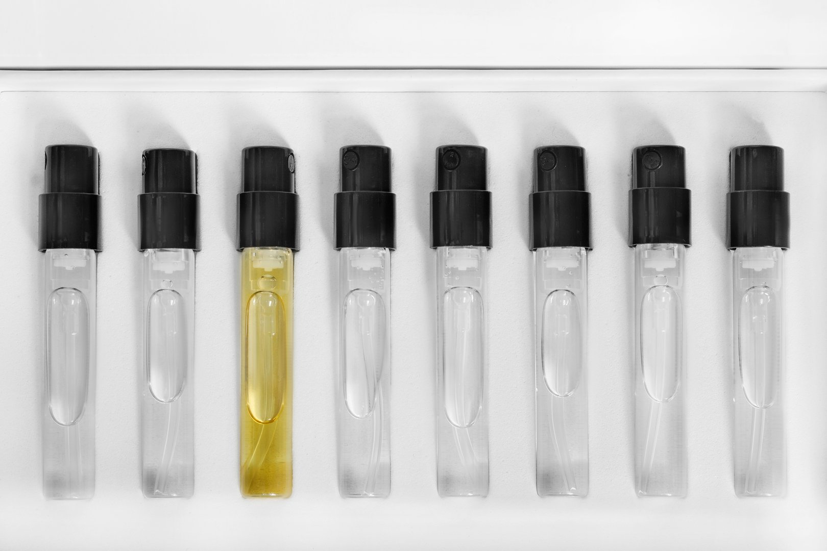 Kit of eight perfume samples in white pack box closeup