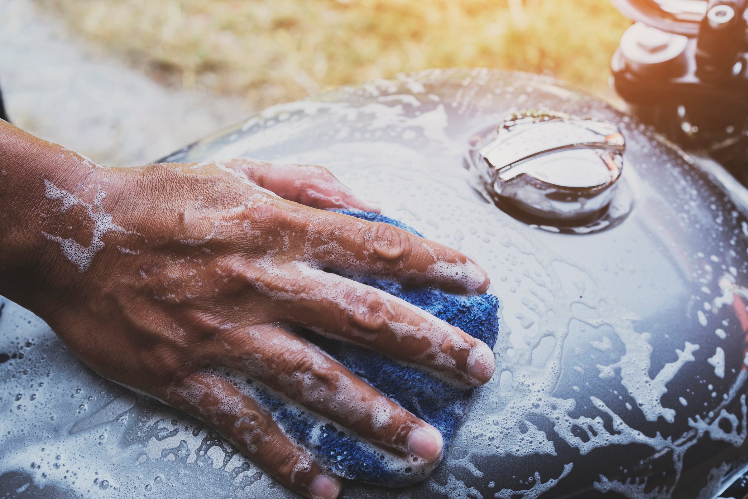 people wash cleaning motorcycle at home