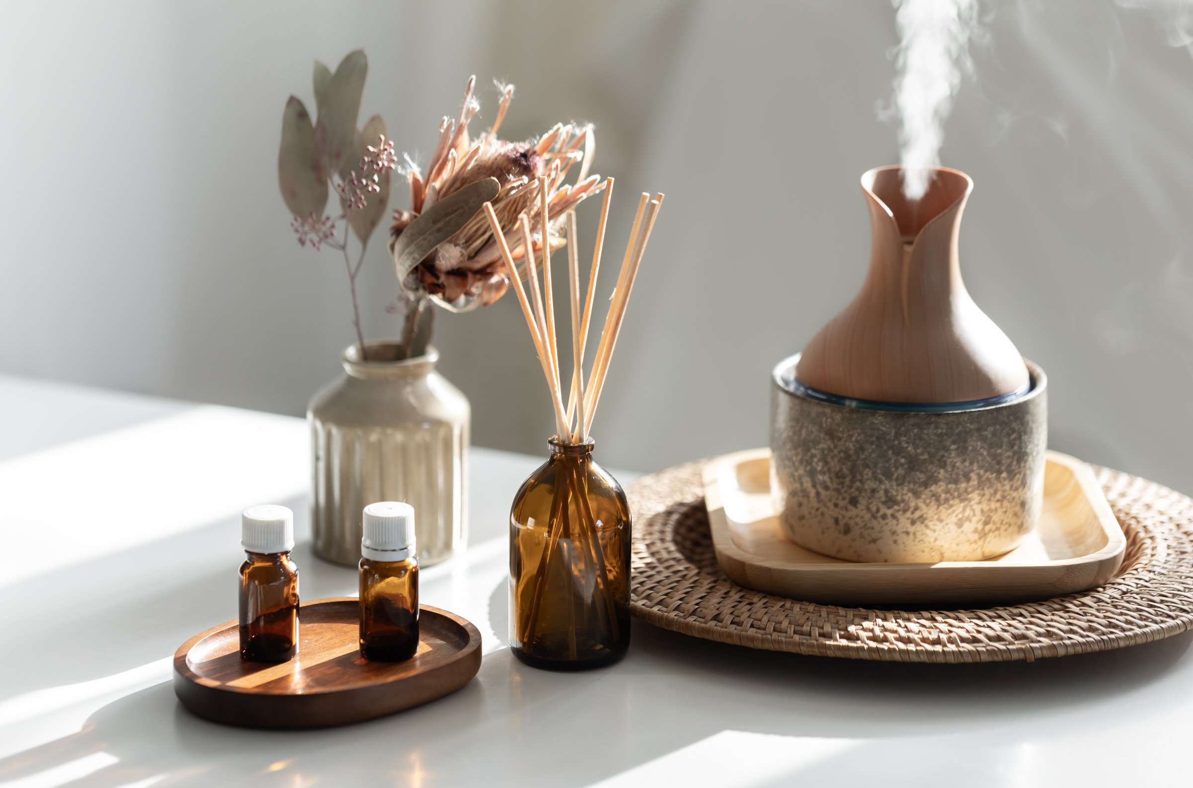 Spa composition with incense sticks, air humidifier and aroma oils. Aroma oil diffuser lamp with the stick perfume.