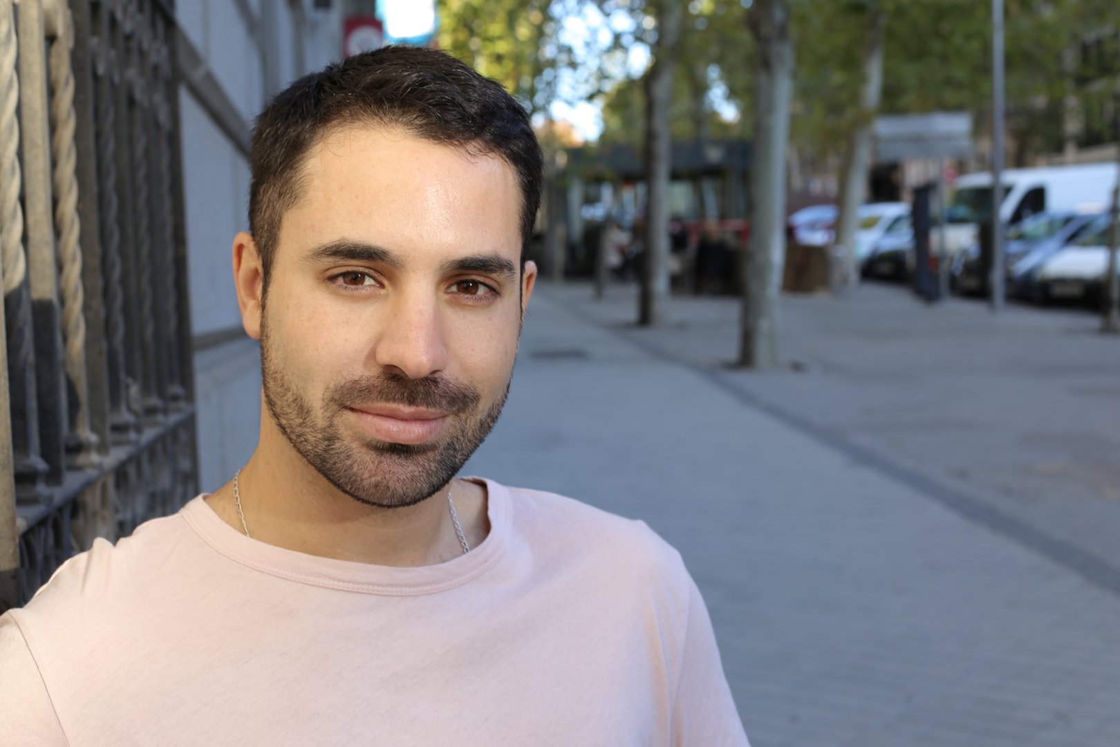 Good looking man headshot outdoors.