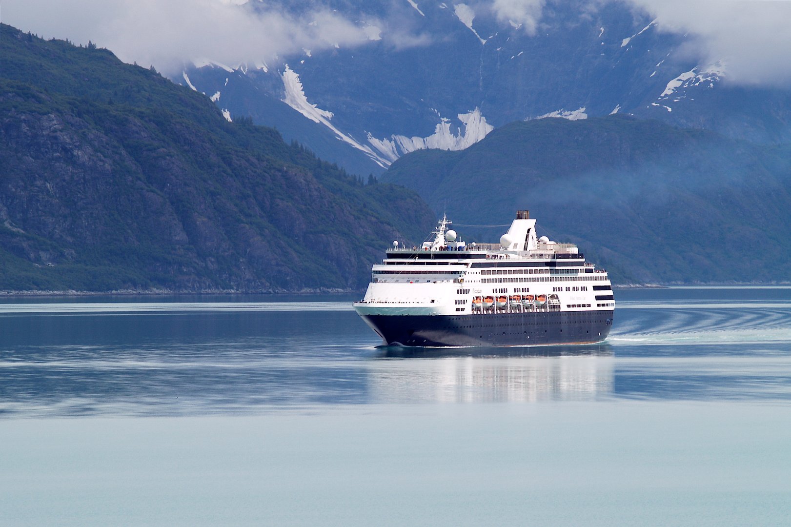 Cruise ship in Alaska with mountains