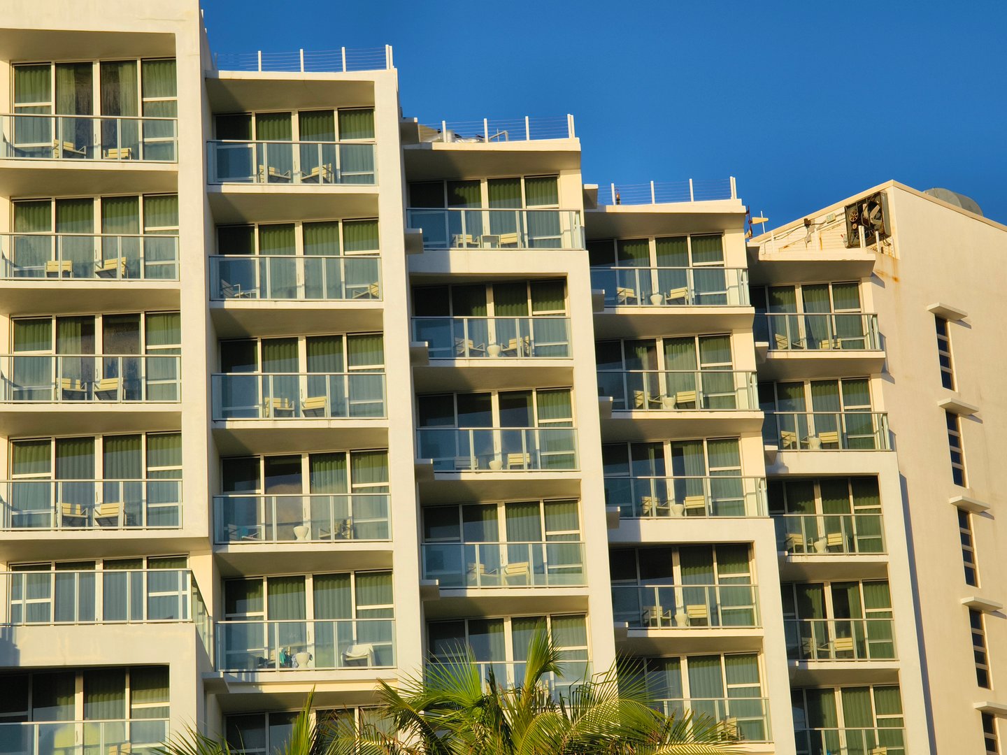 Miami Beach, Florida, USA - June 26, 2024: A luxury beachfront condo during sunrise.