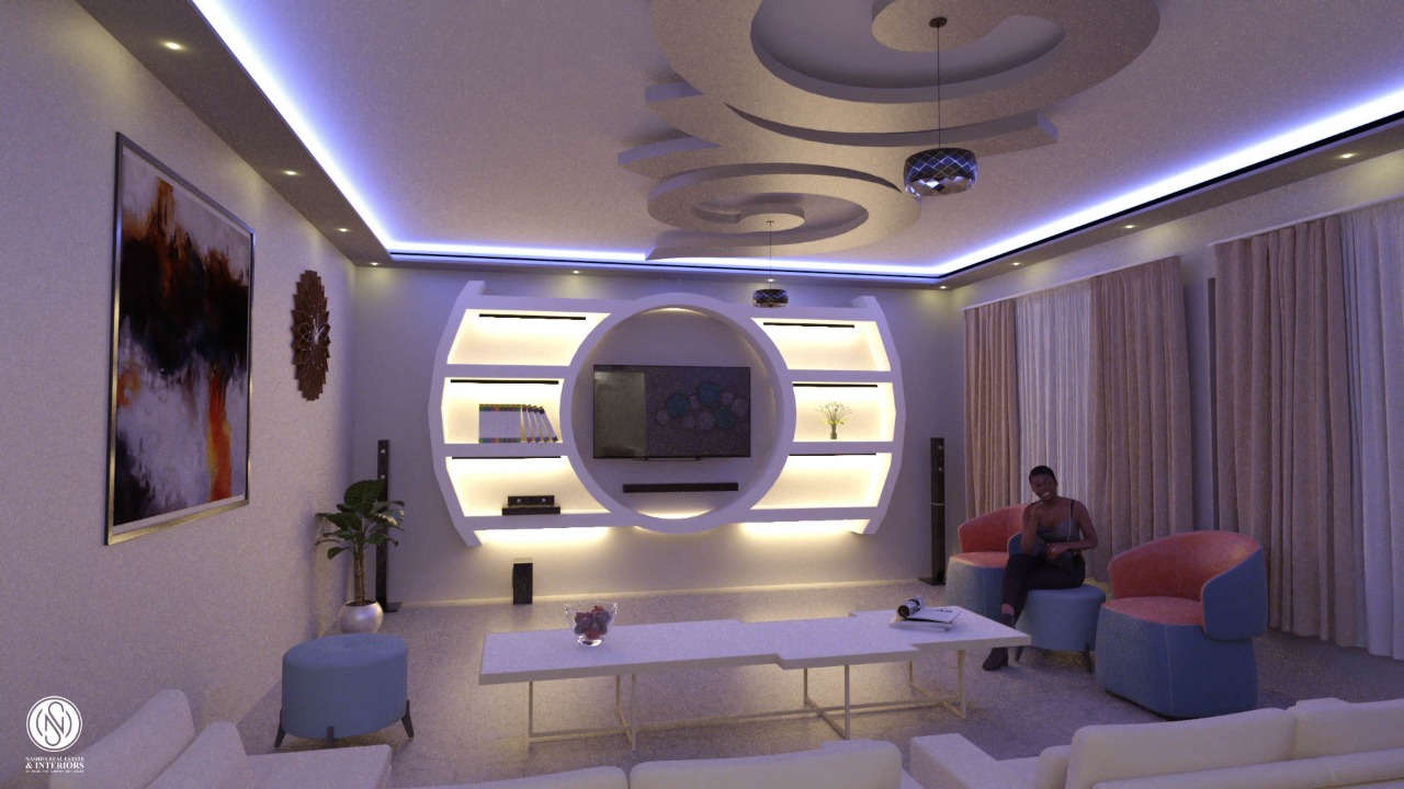 Modern living room with neon lighting, circular wall design, abstract art, and a person sitting on a chair.
