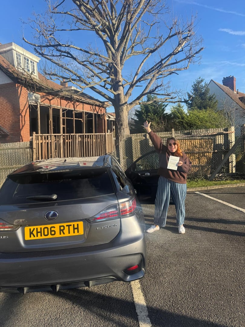 Successful driving test student with pass certificate