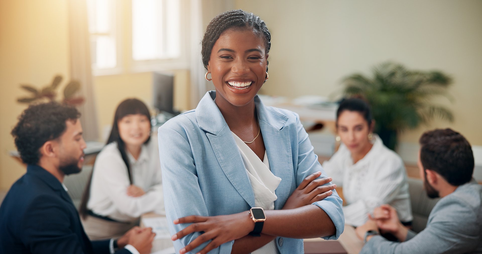 Portrait, group and woman with arms crossed, meeting and feedback for article, reviews and advice Face, magazine editor or journalist with writers, creative or brainstorming with cooperation or smile