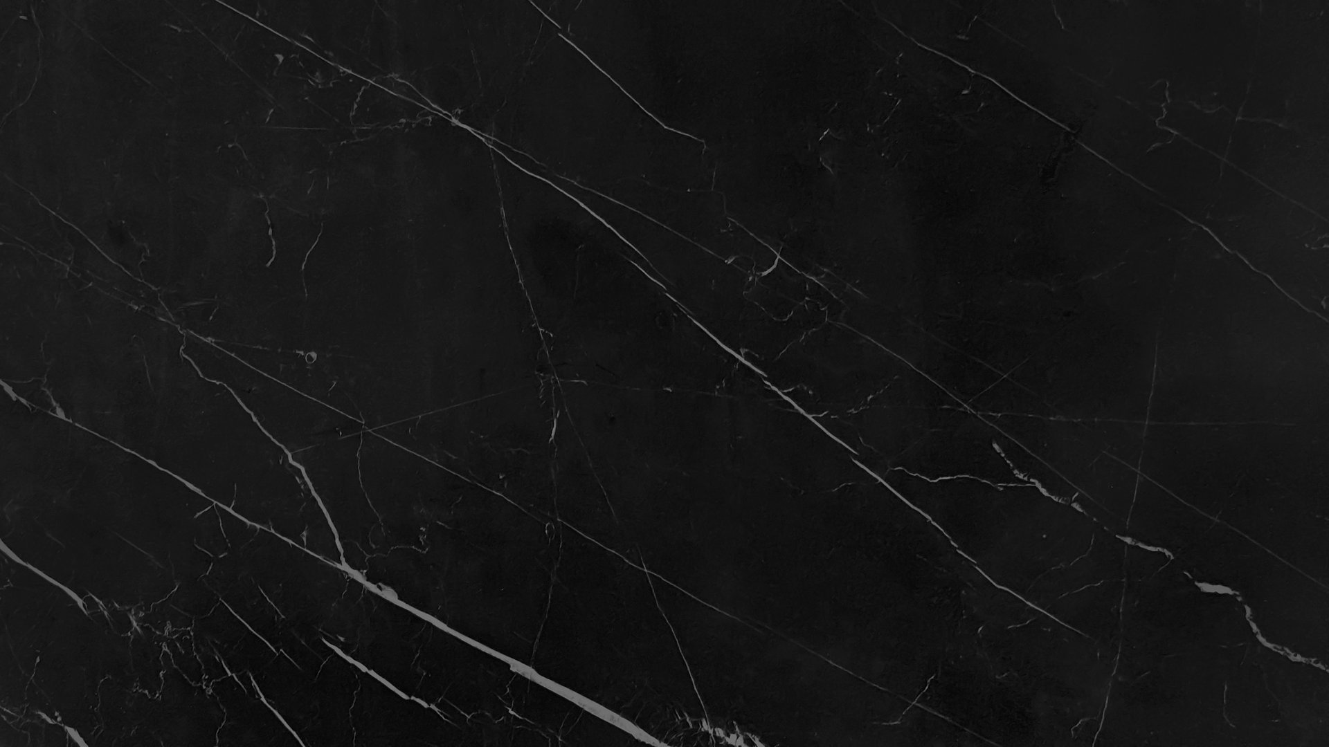 Verdant dark black marble background with intricate white mineral veins