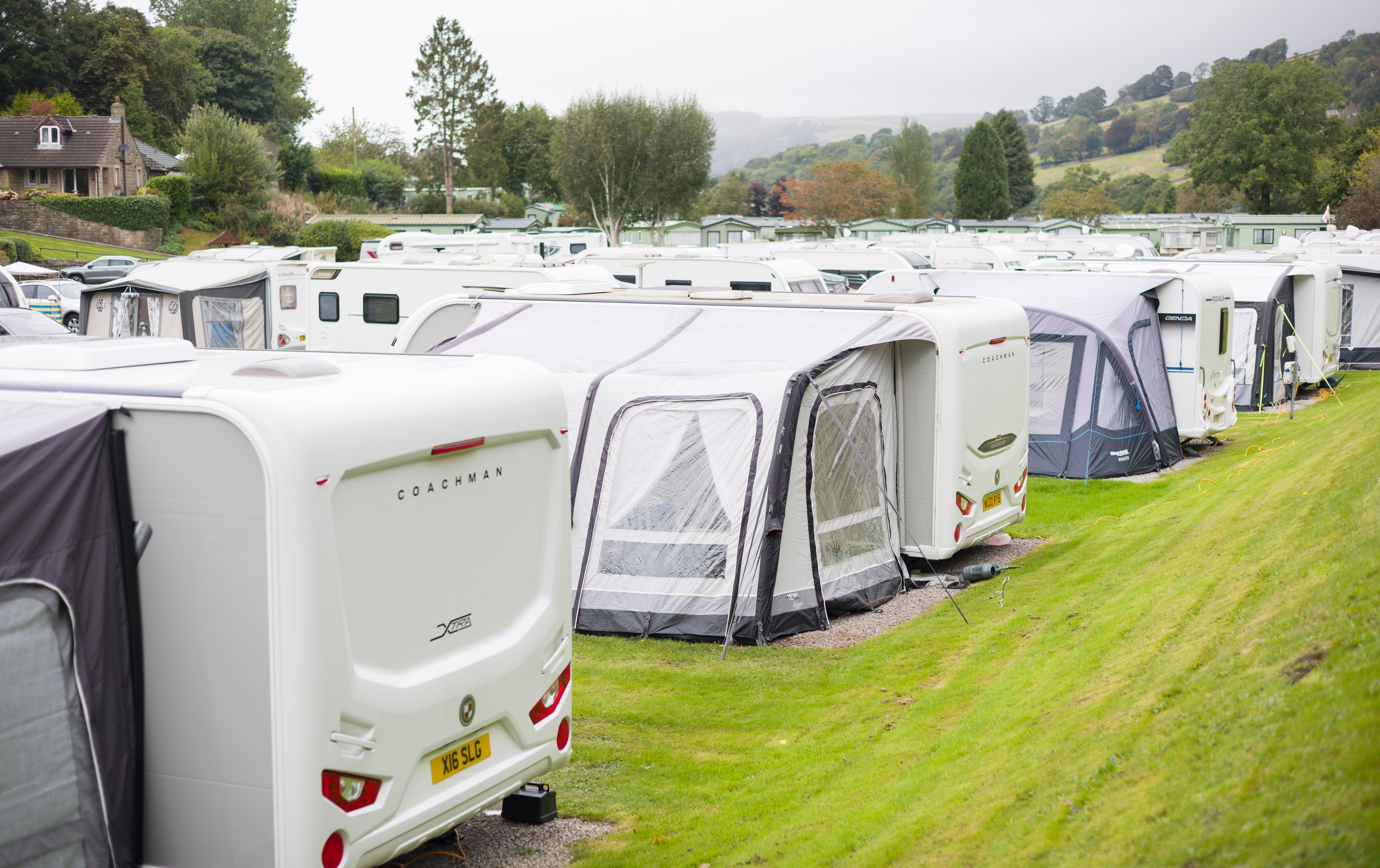 Yorkshire Dales, UK - September 15, 2024. Row of caravans on a caravan site in Pateley Bridge, Nidderdale, North Yorkshire, UK
