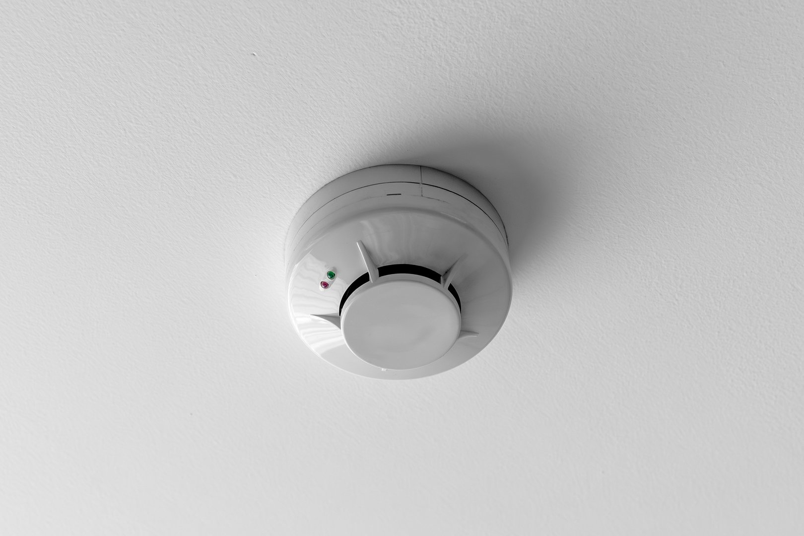 Ceiling-mounted smoke detector for home safety.