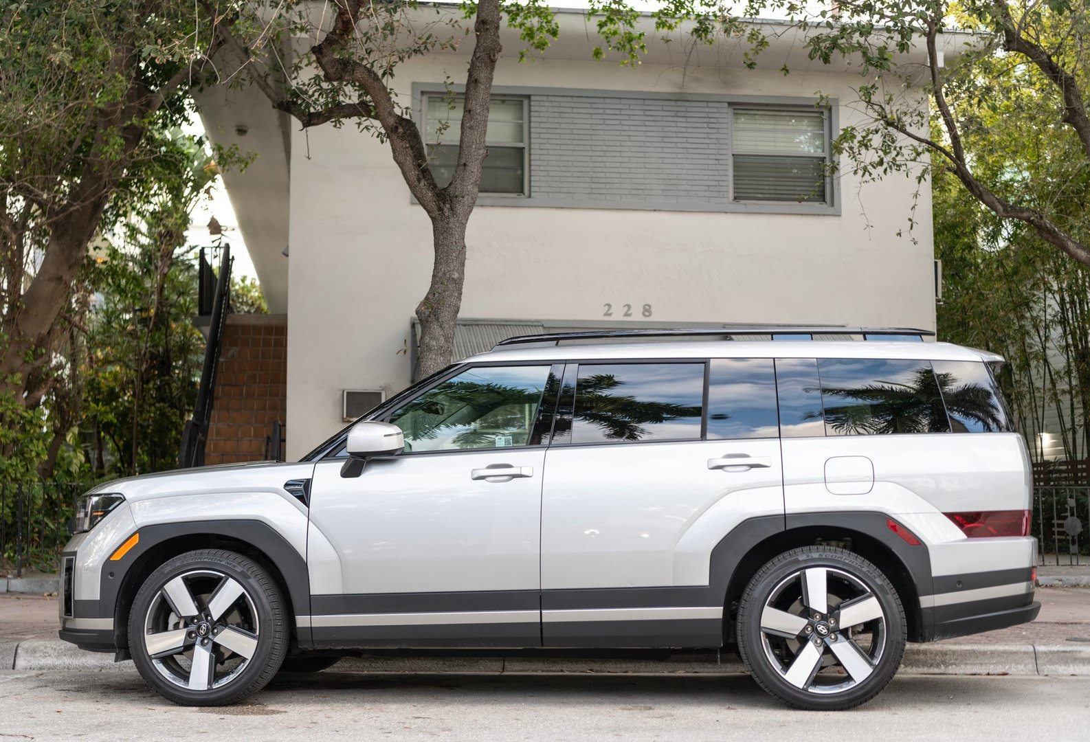 Miami, Florida, USA - December 08, 2024: 2024 Hyundai Santa Fe HEV Limited crossover SUV. Crossover car of Hyundai Santa Fe HEV type. Car of Hyundai parked outdoor. Hyundai Santa Fe, corner view.