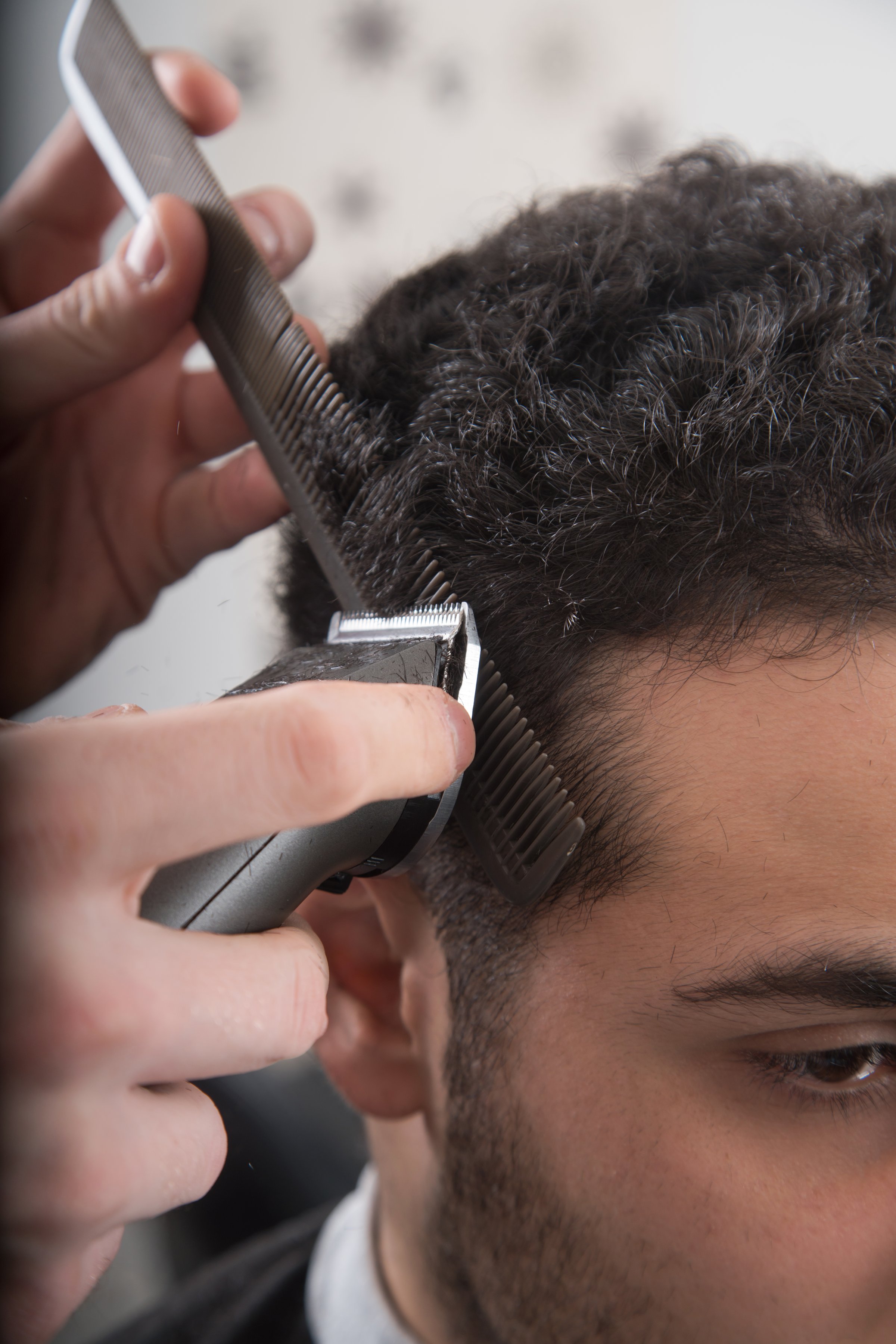 Men's haircut at the barber scissors