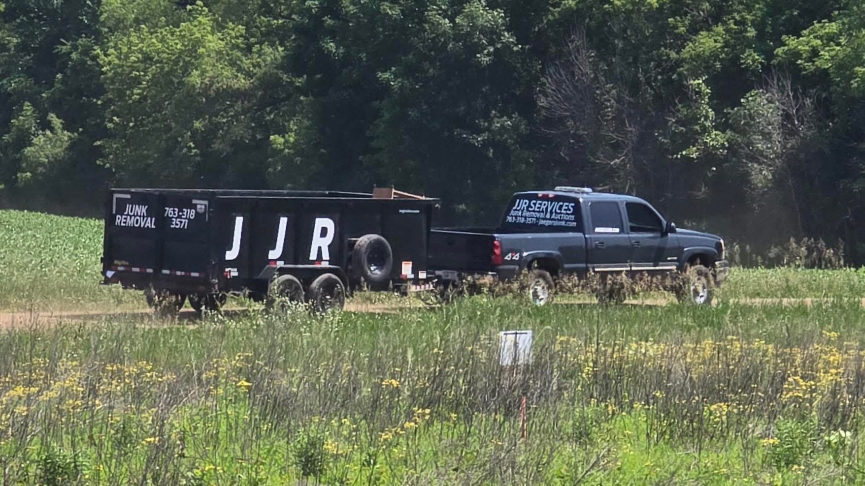 JJR Services team with truck for junk removal and demolition