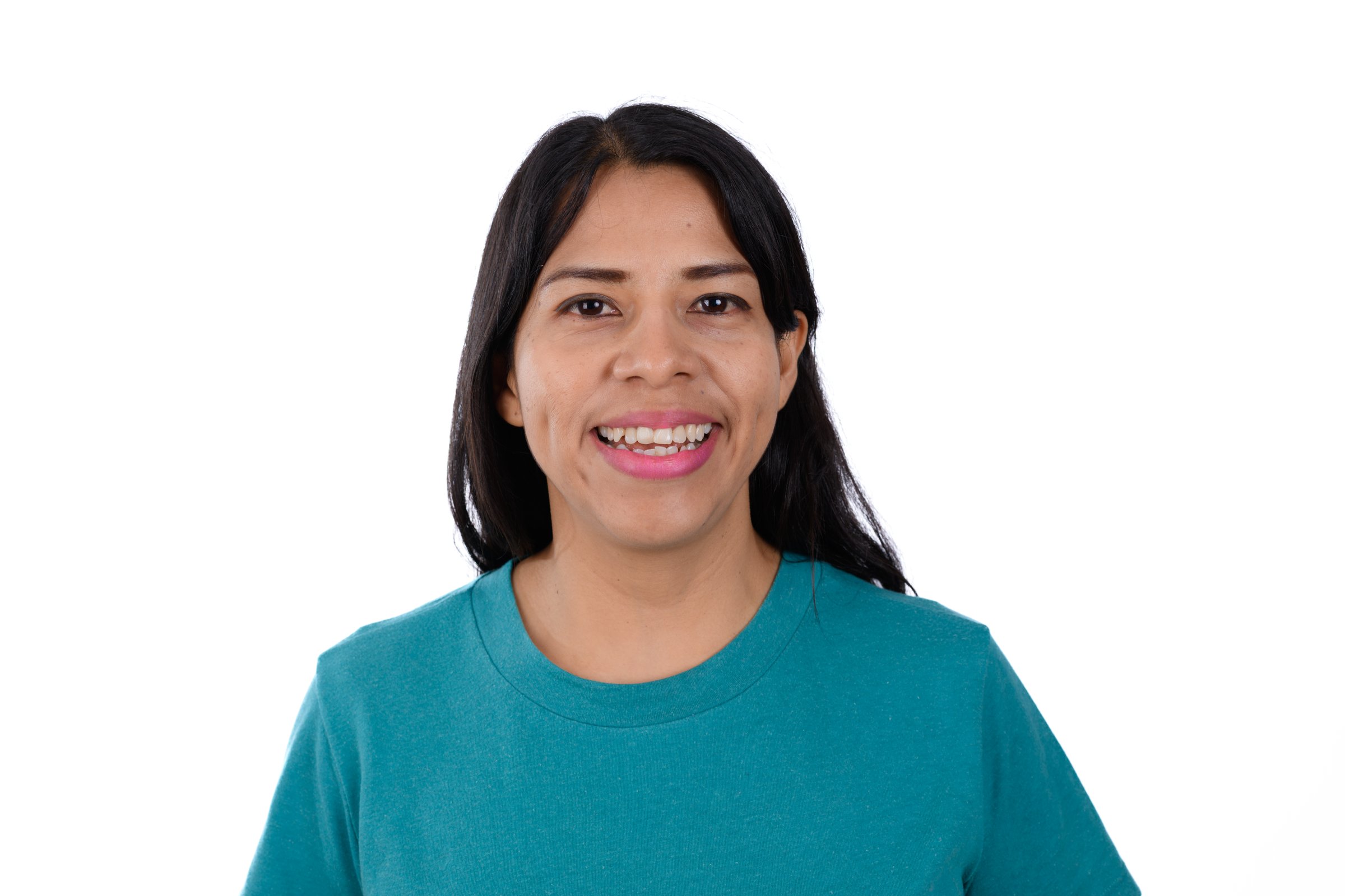 Happy young woman smiling wearing blue T-shirt isolated on white background