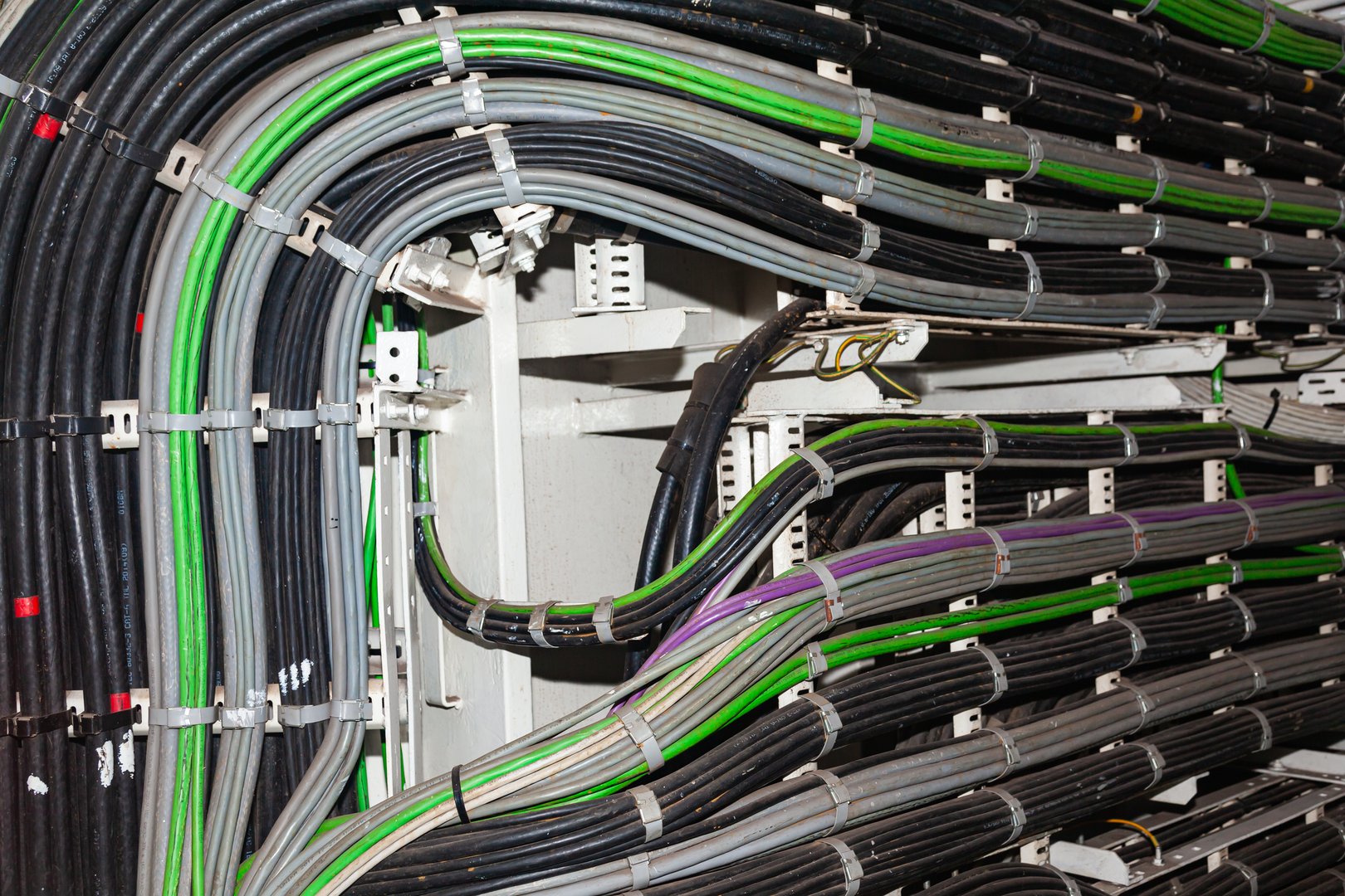 Line of installed industrial electrical cables.