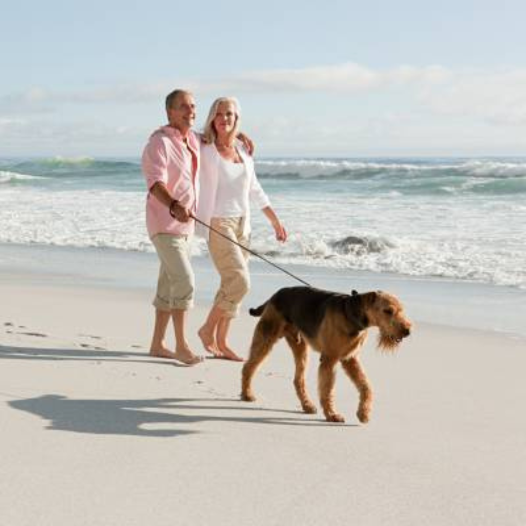 Couple enjoying pet-friendly vacation at The Salty Mermaid Cape San Blas rental