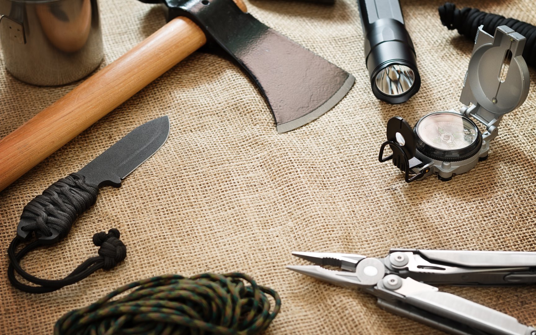 Various equipment for survival on jute fabric