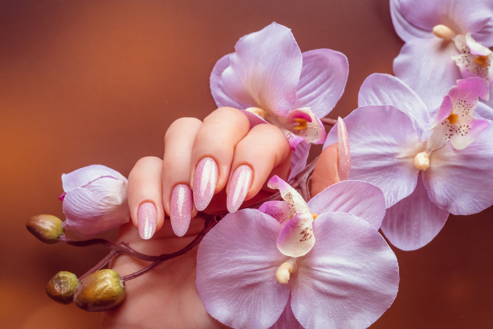 Beautiful Woman Hands . Spa and Manicure concept. Female hands with pink manicure.
