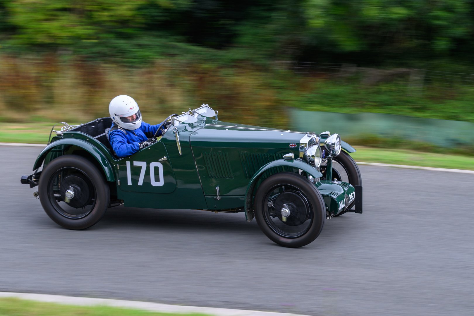Cheltenham, Gloucestershire, England – August 3 2025 Sports vintage motor car racing up a hill